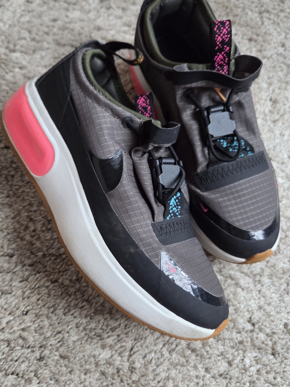 Nike Women's Gray and Black Sneakers with Pink Accents